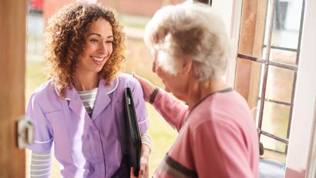 Caregiver arriving at seniors home.