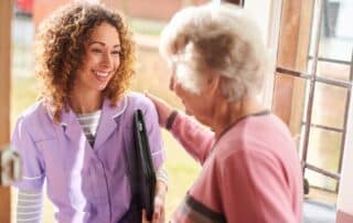 Caregiver arriving at seniors home.