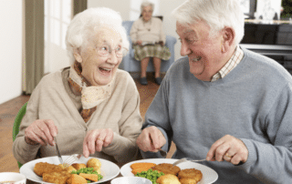 A senior couple enjoying dining in an independent living community in Bradenton, Florida.