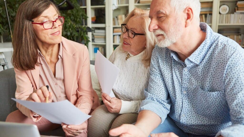Senior care advisor assisting senior couple.