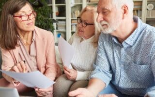 Senior care advisor assisting senior couple.