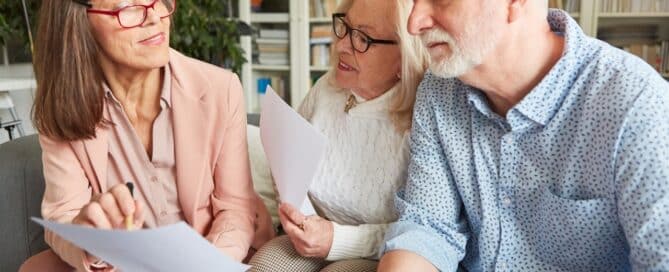 Senior care advisor assisting senior couple.