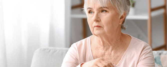 Female senior with dementia looking into the distance.