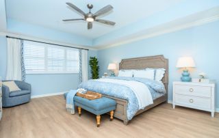 Convivial Jacaranda Trace apartment bedroom.