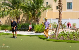 Grand Living at Wellen Park Residents Playing Mini Golf.