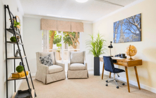 Grand-Villa-of-Sarasota-Apartment-Bedroom apartment with a home office with two chairs, a desk, and a good lighting.