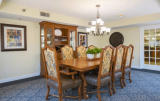 Grand Villa of Sarasota private dining room with a large table and chairs.