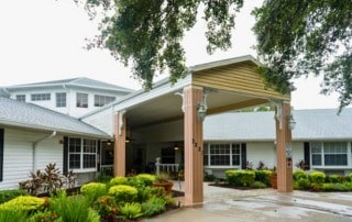 The entrance to a Heron House Sarasota with a covered walkway.