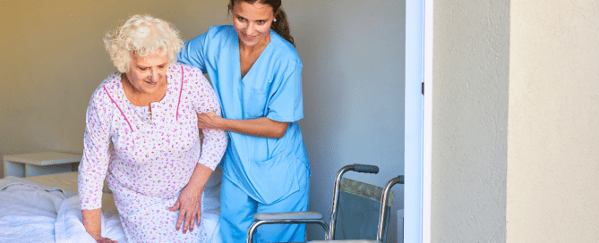 Caregiver helping elderly person in a nursing home