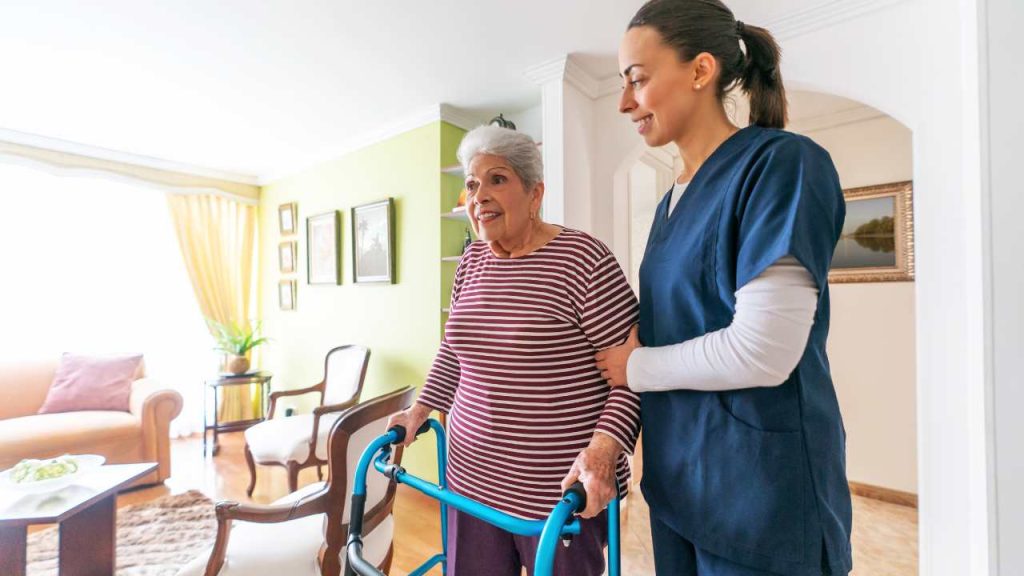 Assisted living tour with senior and caregiver.