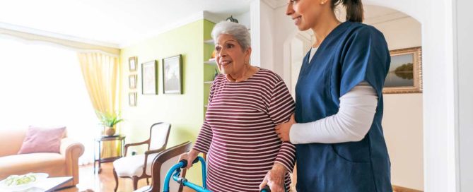 Assisted living tour with senior and caregiver.