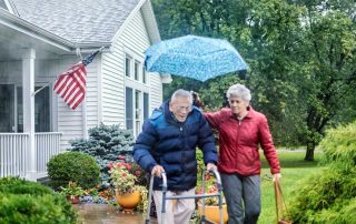 Proud veteran with American Flag at their house - benefits for senior living 2025 guide.