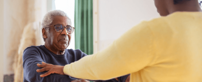 A person helping a senior.