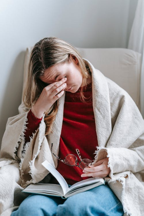 A person rubbing their eyes.