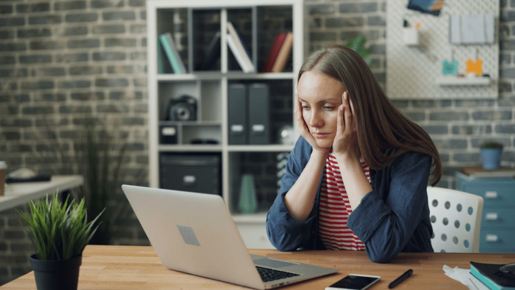 A person looking at their laptop