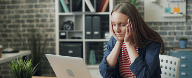 A person looking at their laptop