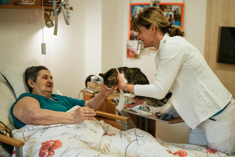 A caregiver with an elderly patient
