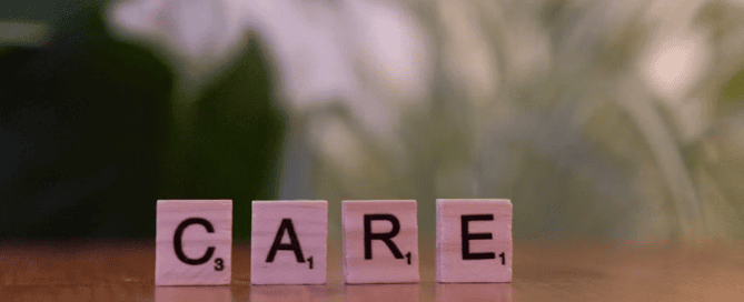 Scrabble tiles spelling ‘care’