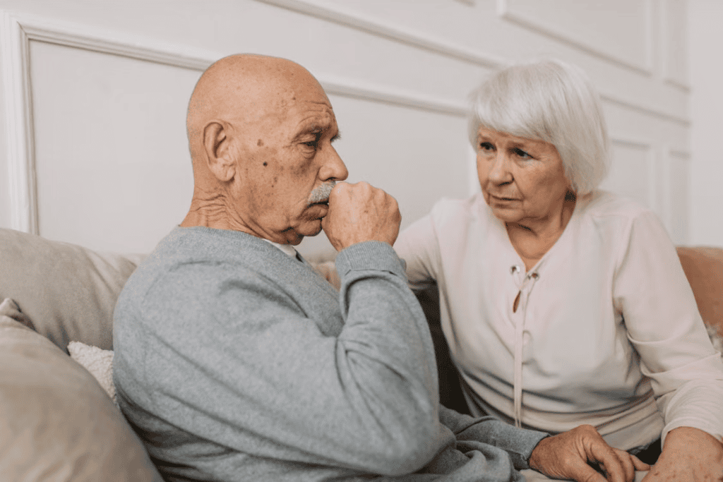 Two elderly people on the couch 