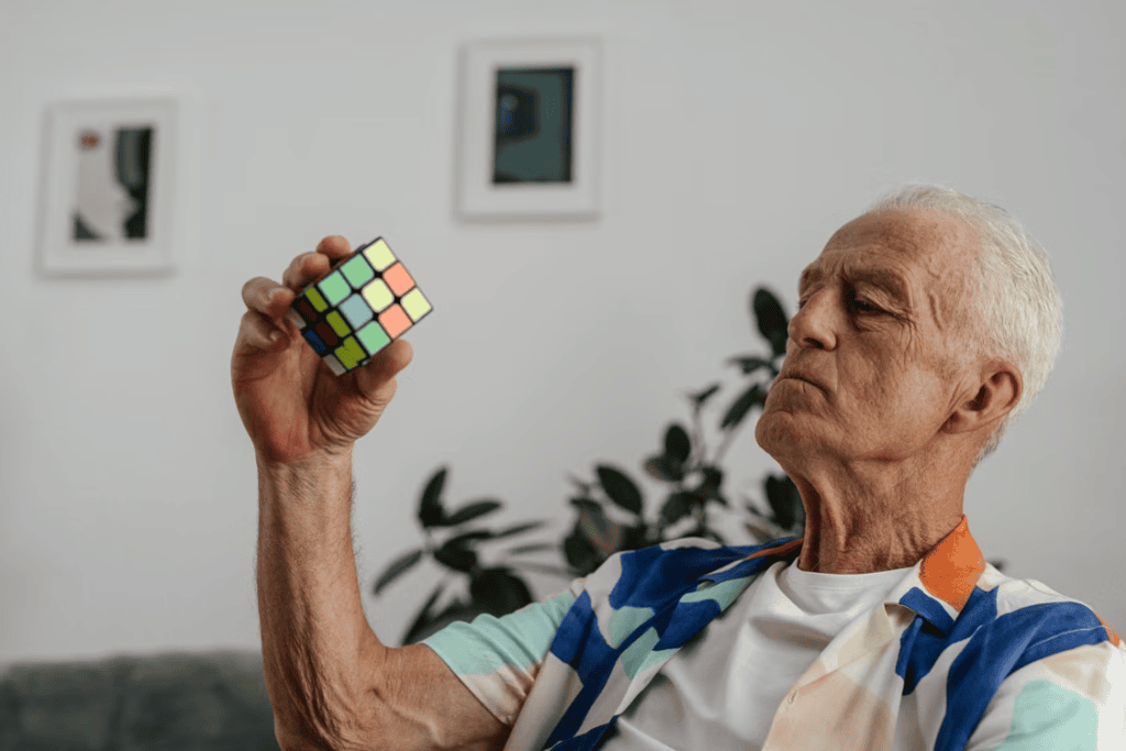  A person holding a rubik cube 