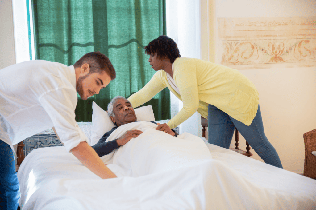 Two people taking care of a senior