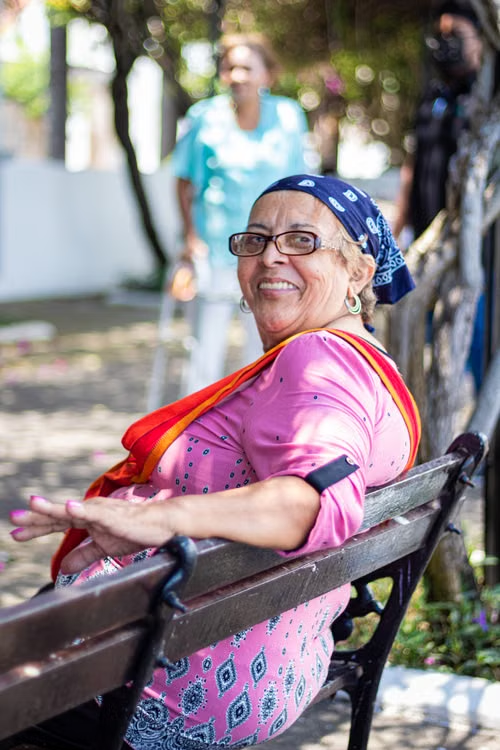 A senior sitting on a bench